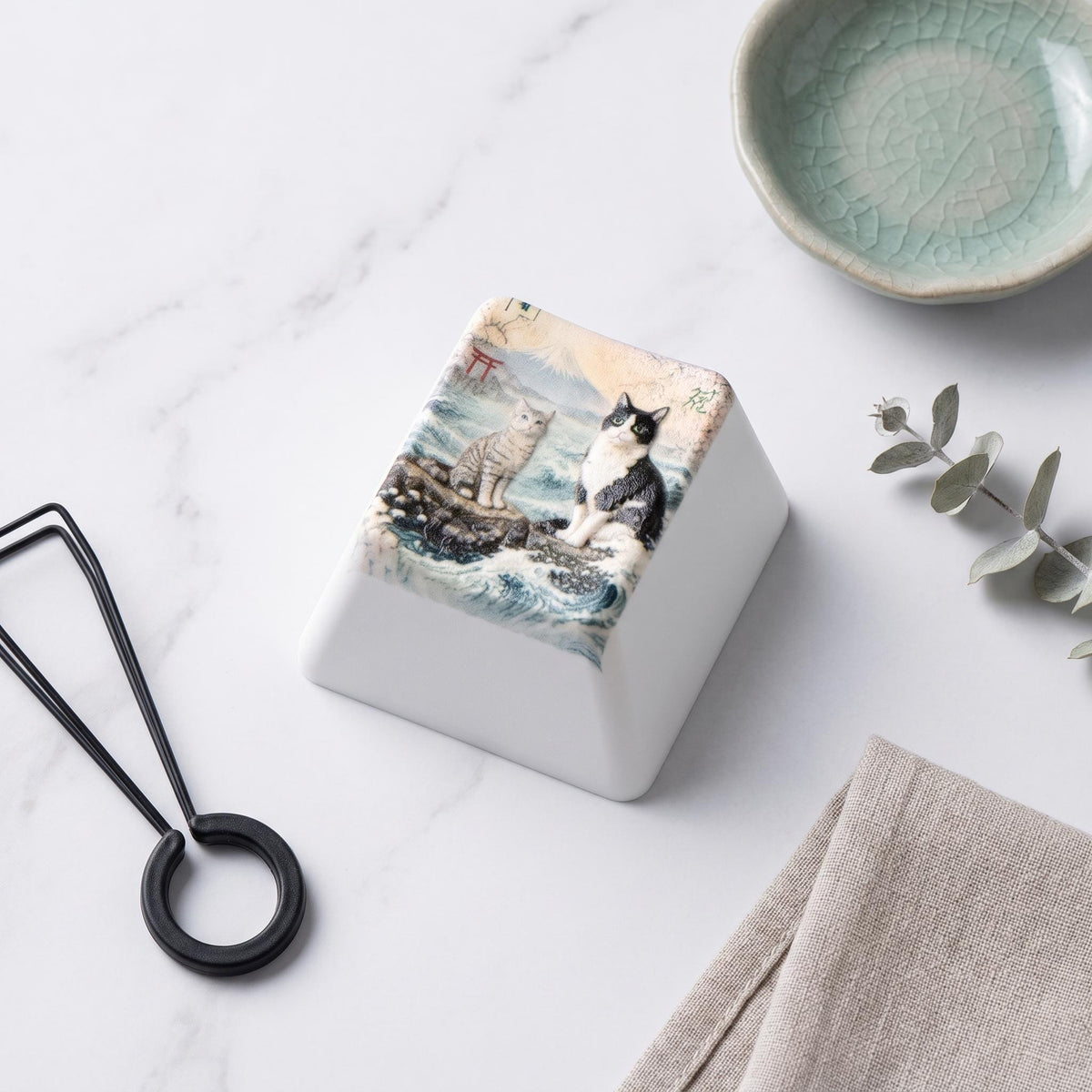 Custom Pet Photo ESC Keycap, Cherry MX Compatible, Dog Cat Memorial Keyboard Accessory with the painted two-cats illustration, styled flat lay on white marble beside a keycap puller, a green ceramic bowl and a eucalyptus sprig