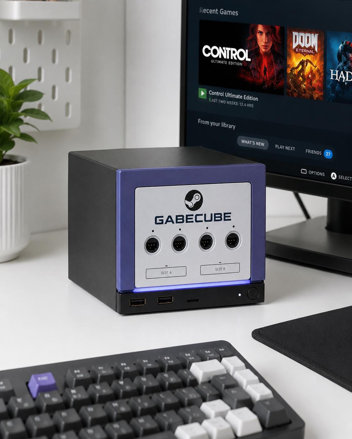3D Printed GameCube Faceplate – Indigo Purple Steam Machine Controller Panel, GabeCube indigo purple faceplate installed on the console on a white desk beside a monitor showing a game library, with a mechanical keyboard nearby