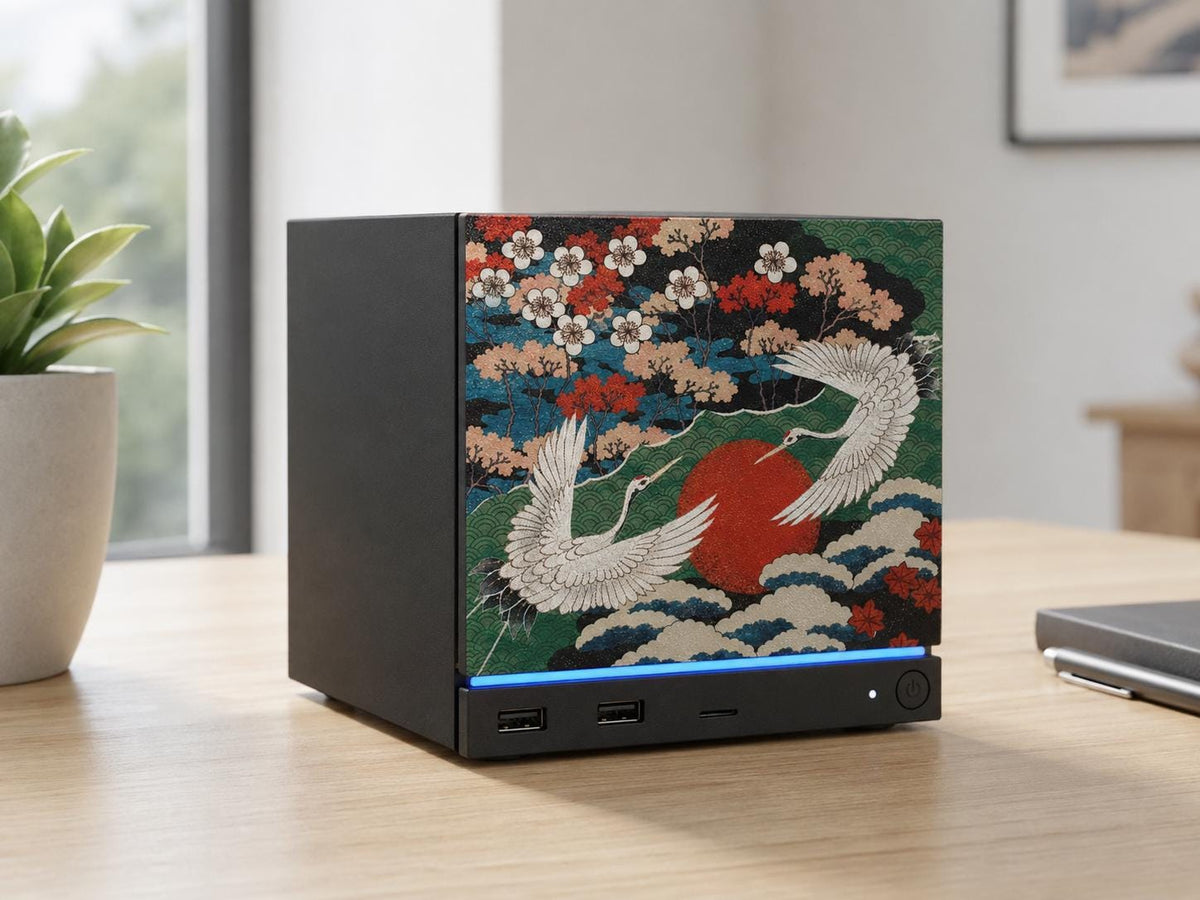 Japanese Crane Steam Machine Faceplate – UV Printed Front Panel | Red Sun & Cherry Blossom Art | Custom Mini PC Cover | Gamer Gift, front view of the crane faceplate with two cranes over a red sun, shown installed on the console on a light wooden desk in a home office, with a plant and window nearby
