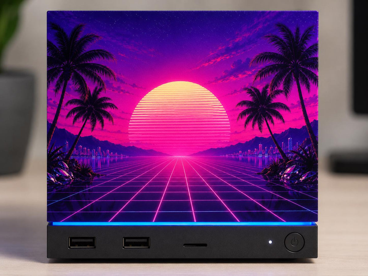 Synthwave Steam Machine Faceplate UV Printed Front Panel | Retro Neon Sunset Grid Art | Custom Mini PC Cover | Gamer Gift, close-up front view of the Steam Machine with the synthwave faceplate, showing the full neon sunset, palm trees and grid artwork on a light wooden desk