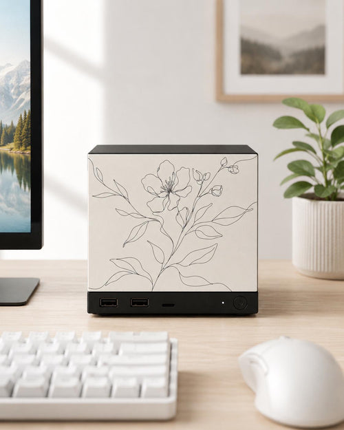 Botanical Line Art Steam Machine Faceplate | Minimalist Plant UV Print Skin with a delicate black line-drawn flower and leaves, shown installed on the console on a light wood desk beside a white keyboard and mouse