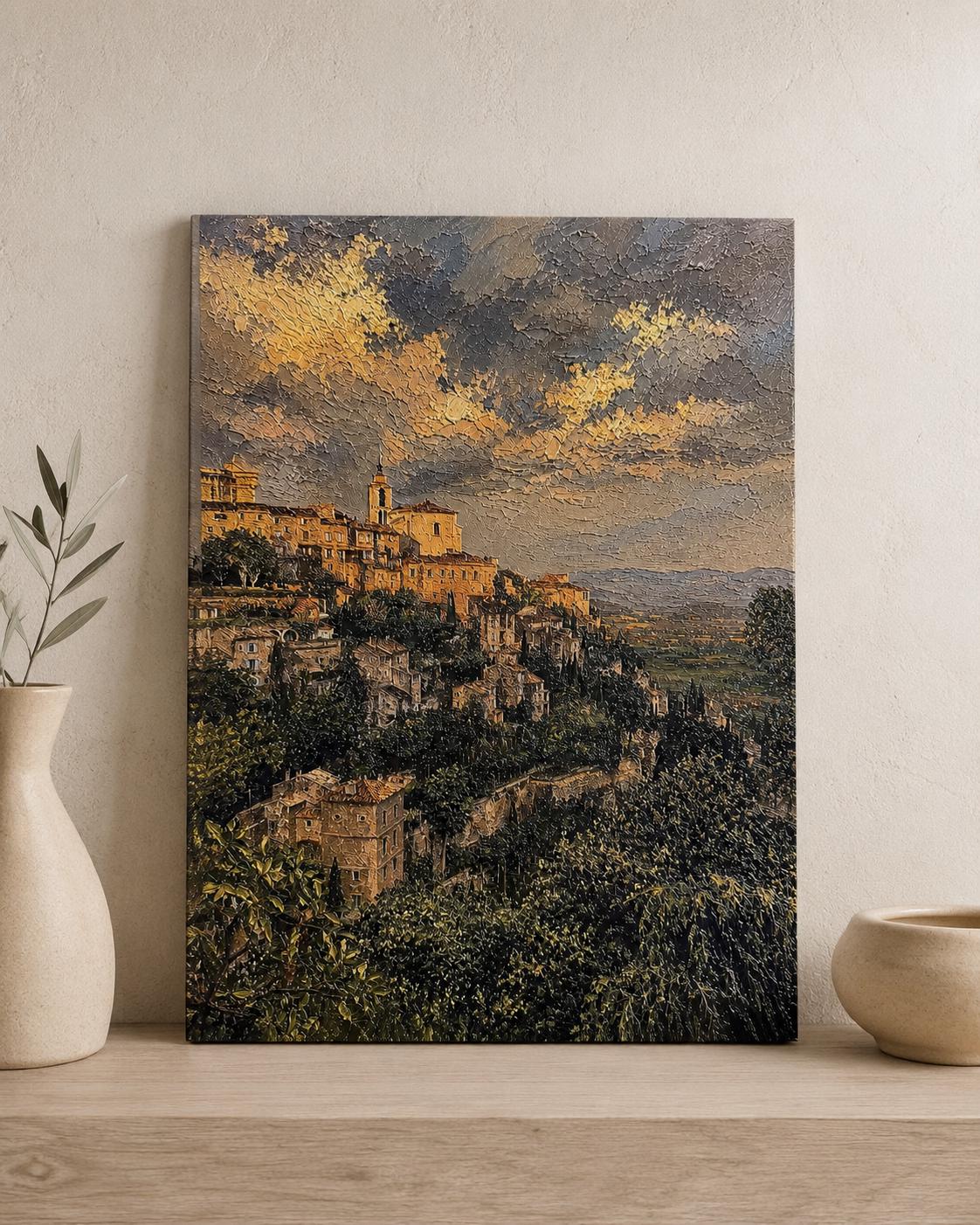 Tuscany Hill Town Textured Painting Print styled on a light wood surface beside a white ceramic vase and a small bowl against a textured beige wall