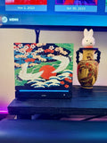 Japanese Crane Steam Machine Faceplate – UV Printed Front Panel | Red Sun & Cherry Blossom Art | Custom Mini PC Cover | Gamer Gift, crane faceplate with two white cranes in flight over a red sun, shown installed on the console on a dark wooden shelf beside a decorative gold vase with a rabbit figurine and a TV screen behind