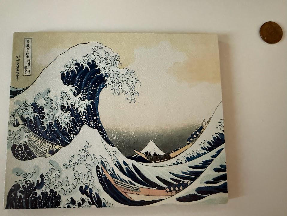 Hokusai Wave Steam Machine Faceplate, UV Printed Japanese Art Console Skin, flat lay of the uninstalled Great Wave faceplate panel on a light beige surface with a copper coin for scale