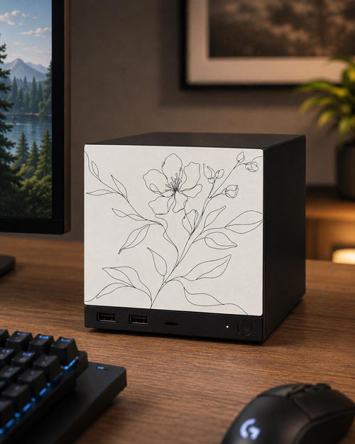 Botanical Line Art Steam Machine Faceplate | Minimalist Plant UV Print Skin with a delicate black line-drawn flower and leaves, shown installed on the console on a dark wooden desk beside a black keyboard and mouse