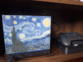 Starry Night Steam Machine Faceplate: Van Gogh Art UV Printed Magnetic Panel, Starry Night faceplate installed on the Steam Machine on a wooden shelf, with a Steam controller on its charging dock beside it