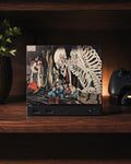 Steam Machine Faceplate, Kuniyoshi Ukiyo-e Skeleton Art, UV Printed Panel with the colossal skeleton ukiyo-e artwork, straight-on front view installed on the console on a dark wooden shelf with a plant and a game controller