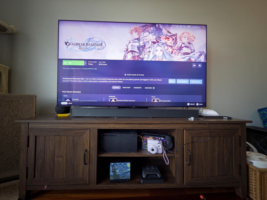 New Mesh!! Starry Night Steam Machine Faceplate Van Gogh Front Panel Fine Art UV Printed Magnetic Classic Painting Gamer Gift on the console, visible on the middle shelf of a living room TV stand beneath a large TV