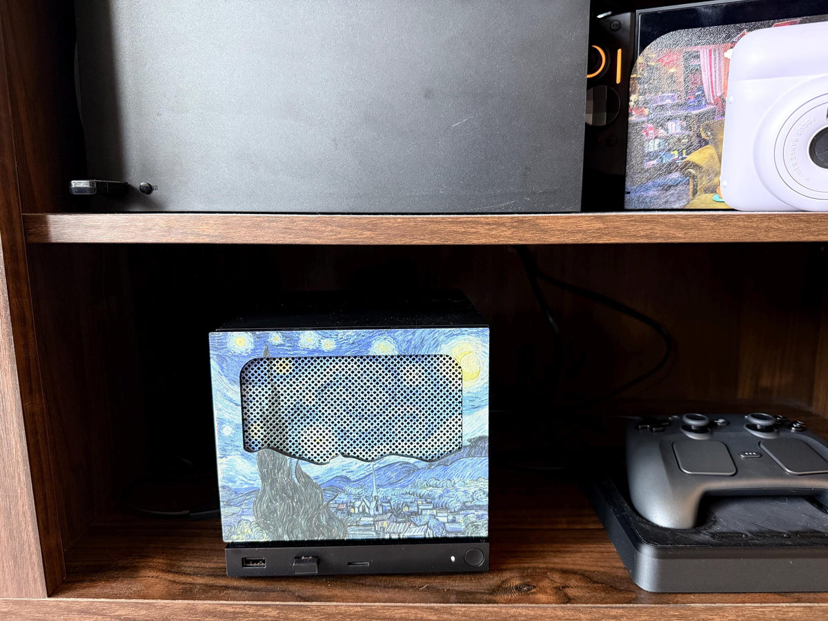 New Mesh!! Starry Night Steam Machine Faceplate Van Gogh Front Panel Fine Art UV Printed Magnetic Classic Painting Gamer Gift on the console, styled on a wooden entertainment shelf beside a game controller