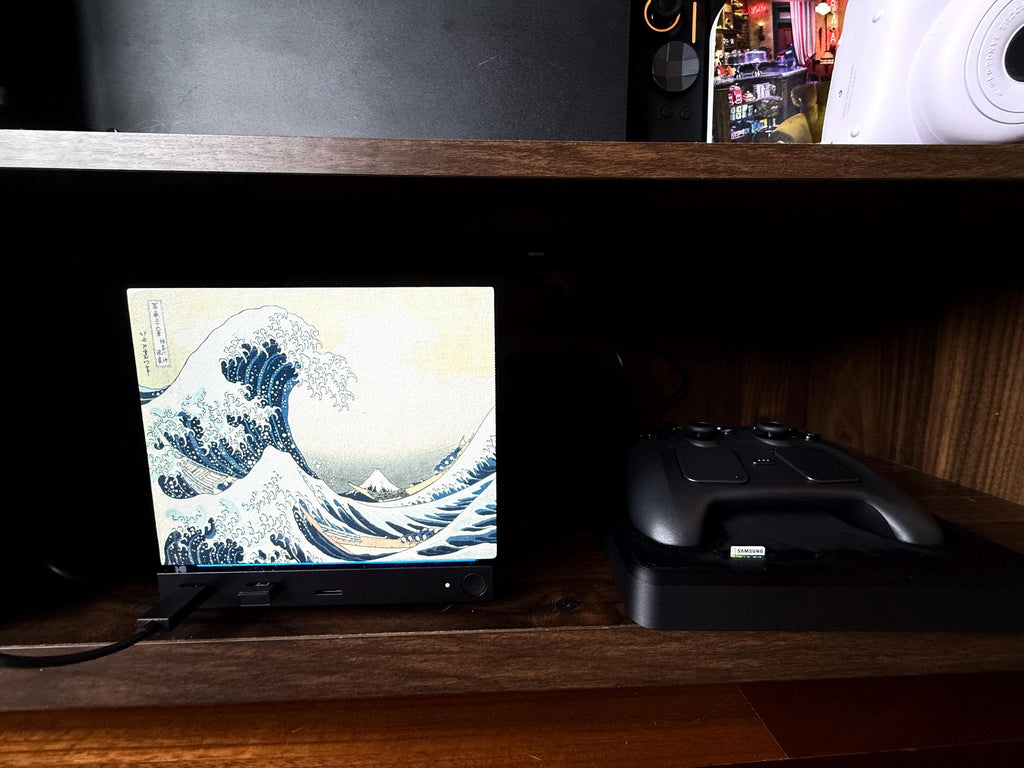 Hokusai Wave Steam Machine Faceplate, UV Printed Japanese Art Console Skin, angled view of the Steam Machine with the Great Wave faceplate installed on a wooden shelf next to a Steam controller on its dock