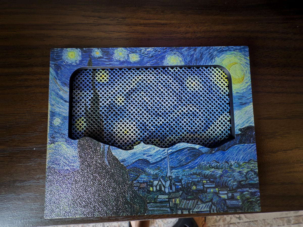 New Mesh!! Starry Night Steam Machine Faceplate Van Gogh Front Panel Fine Art UV Printed Magnetic Classic Painting Gamer Gift, detached from the console and lying flat on a dark wooden surface, top-down view of the Starry Night print with the mesh airflow grille