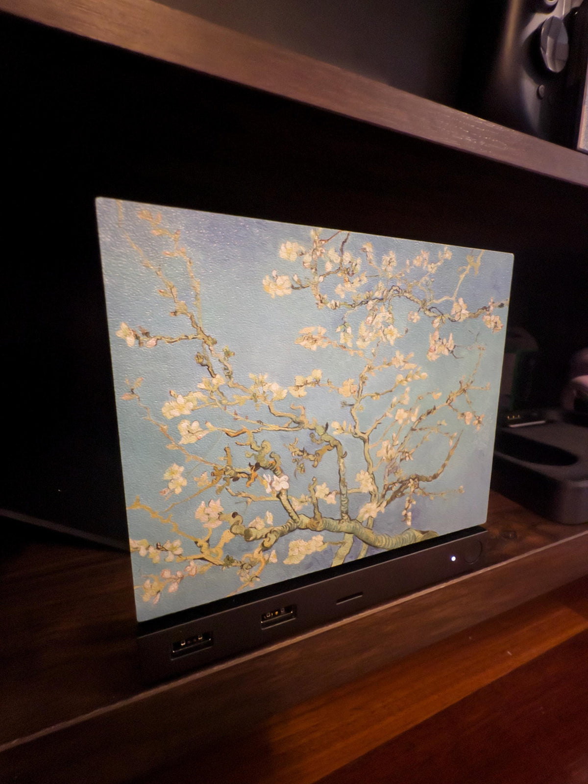 Van Gogh Almond Blossom Steam Machine Faceplate, Magnetic Art Cover Gaming Decor, angle view of the Steam Machine with the Almond Blossom faceplate installed on a dark wooden shelf with a soundbar below it