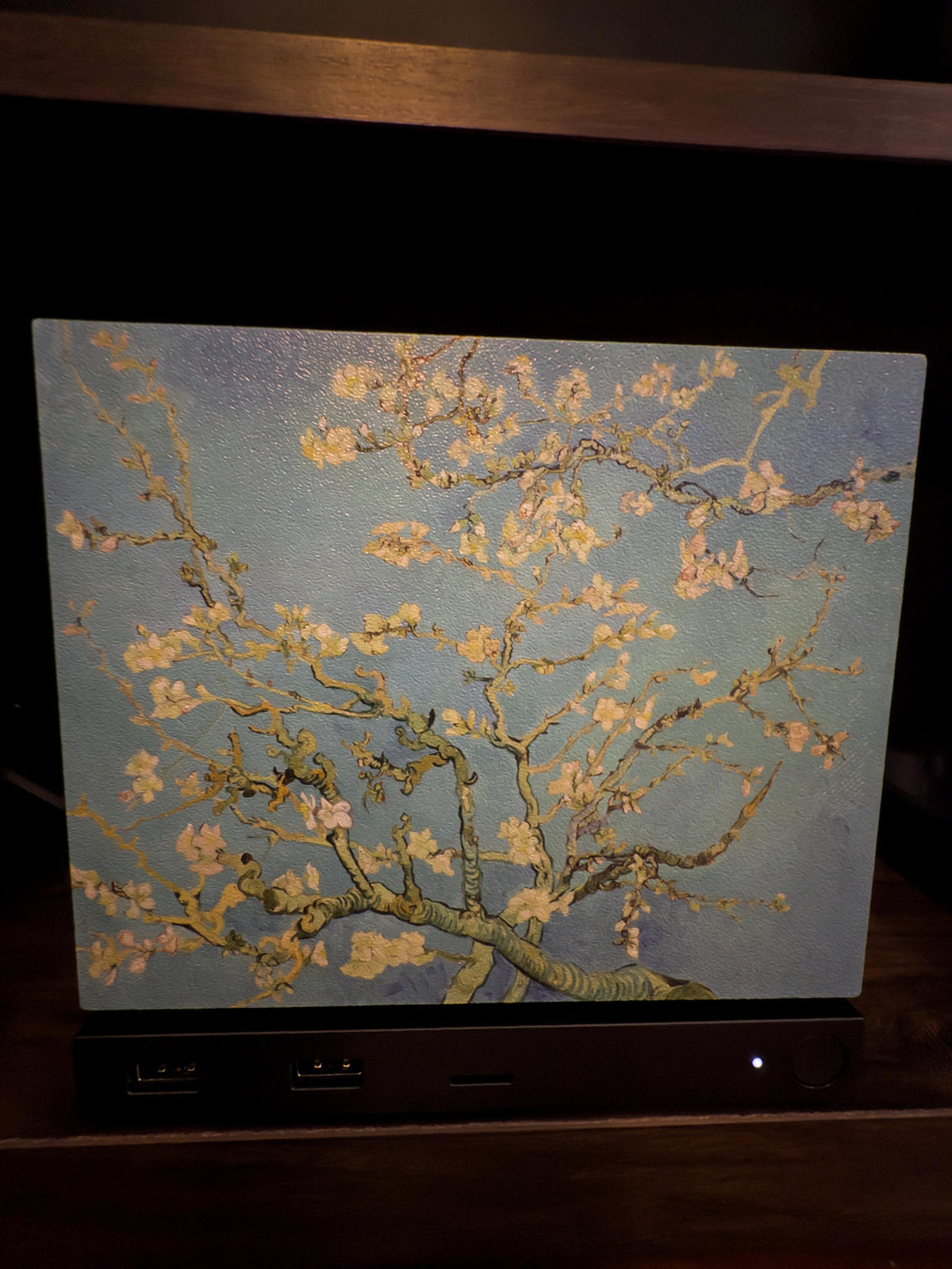 Van Gogh Almond Blossom Steam Machine Faceplate, Magnetic Art Cover Gaming Decor, straight-on close-up of the Steam Machine with the Almond Blossom faceplate installed on a dark wooden shelf