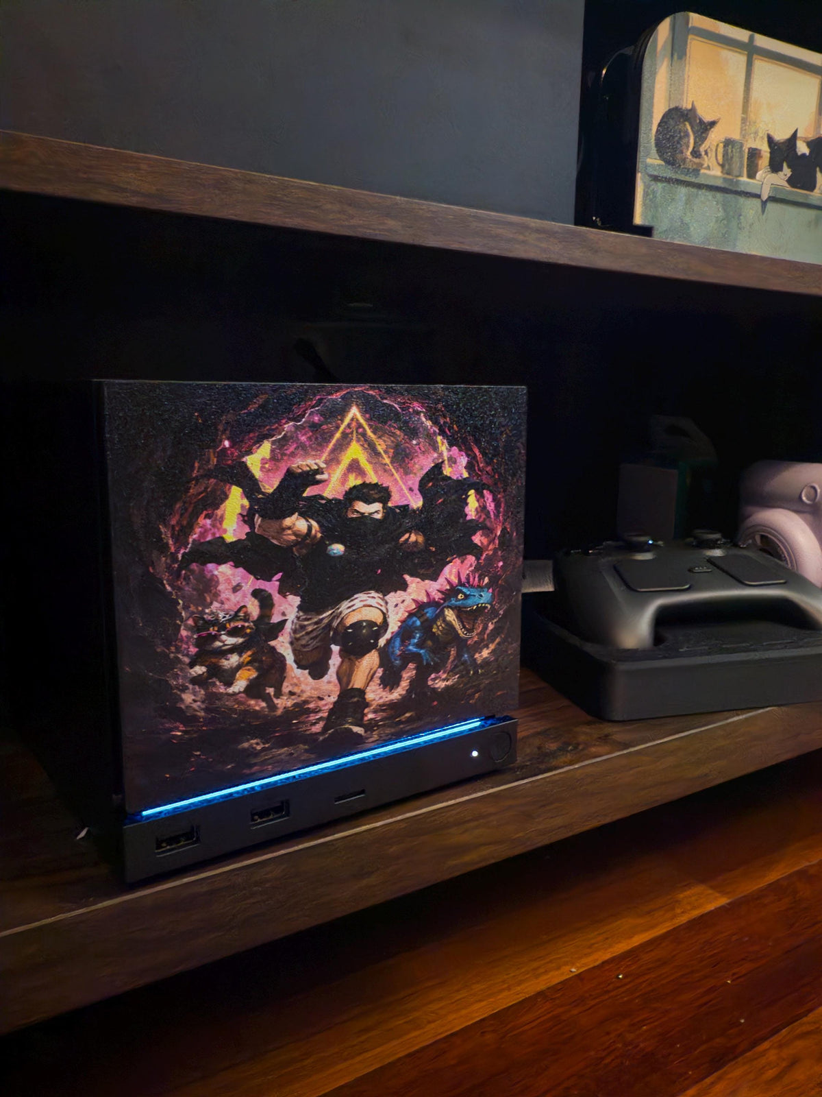 Dungeon Crawler Carl Steam Machine Faceplate | Licensed Landfin Studio Art (UV Printed) with Carl leaping through the glowing dungeon portal, angled view installed on the console on a wooden shelf with a cat lamp on the shelf above