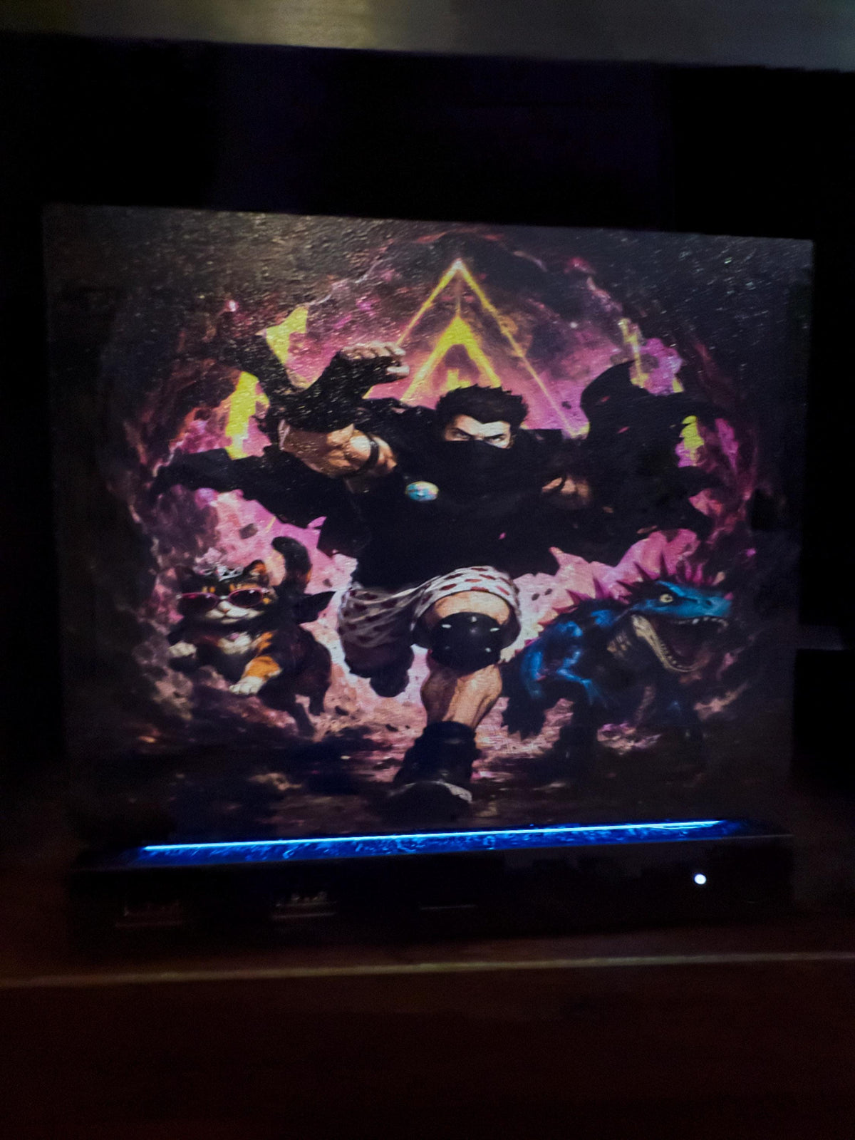 Dungeon Crawler Carl Steam Machine Faceplate | Licensed Landfin Studio Art (UV Printed) with Carl leaping through the glowing dungeon portal, close-up straight-on view of the printed artwork installed on the console with the blue LED strip glowing at its base