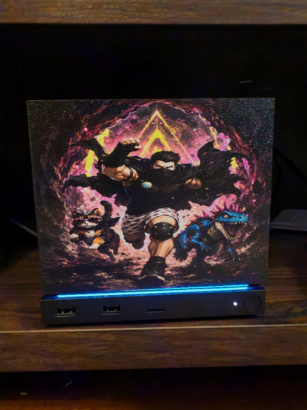 Dungeon Crawler Carl Steam Machine Faceplate | Licensed Landfin Studio Art (UV Printed) with Carl mid leap through a glowing dungeon portal, close-up front view installed on the console on a dark wooden shelf