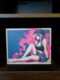 Anime Pinup Art Steam Machine Faceplate | Pink Blue Splatter Print | Magnetic UV Printed Panel | Stylish Gamer Gift with a relaxed anime girl in a black beanie and crop top against a pink and blue splatter background, shown installed on the console on a wooden shelf