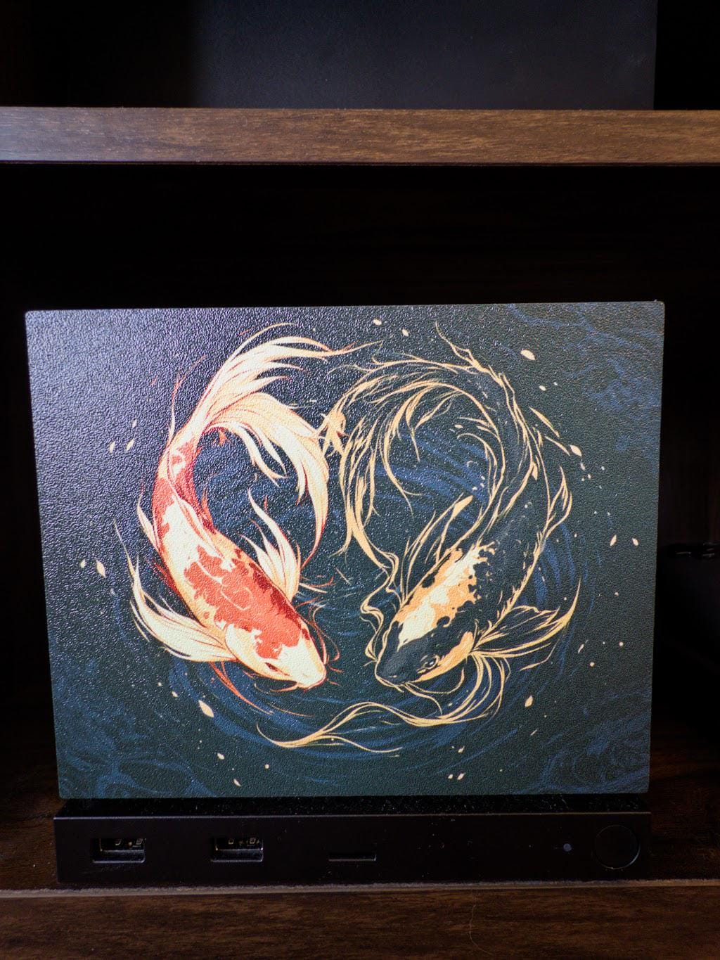 Koi Art Steam Machine Faceplate | Dark Teal Japanese Fish Panel | Magnetic UV Printed Cover | Zen Gamer Gift with two koi circling in dark teal water artwork, close-up straight-on view installed on the console with USB ports visible below