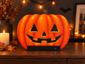 Steam Machine Faceplate Halloween Pumpkin, Classic or Cute Jack o Lantern Magnetic Plate, UV Printed Console Cover, Spooky Gamer Gif, promotional photo of the classic carved jack-o-lantern pumpkin faceplate installed on the Steam Machine on a wooden table, styled with a lit candle, autumn leaves, fairy lights and a bat silhouette