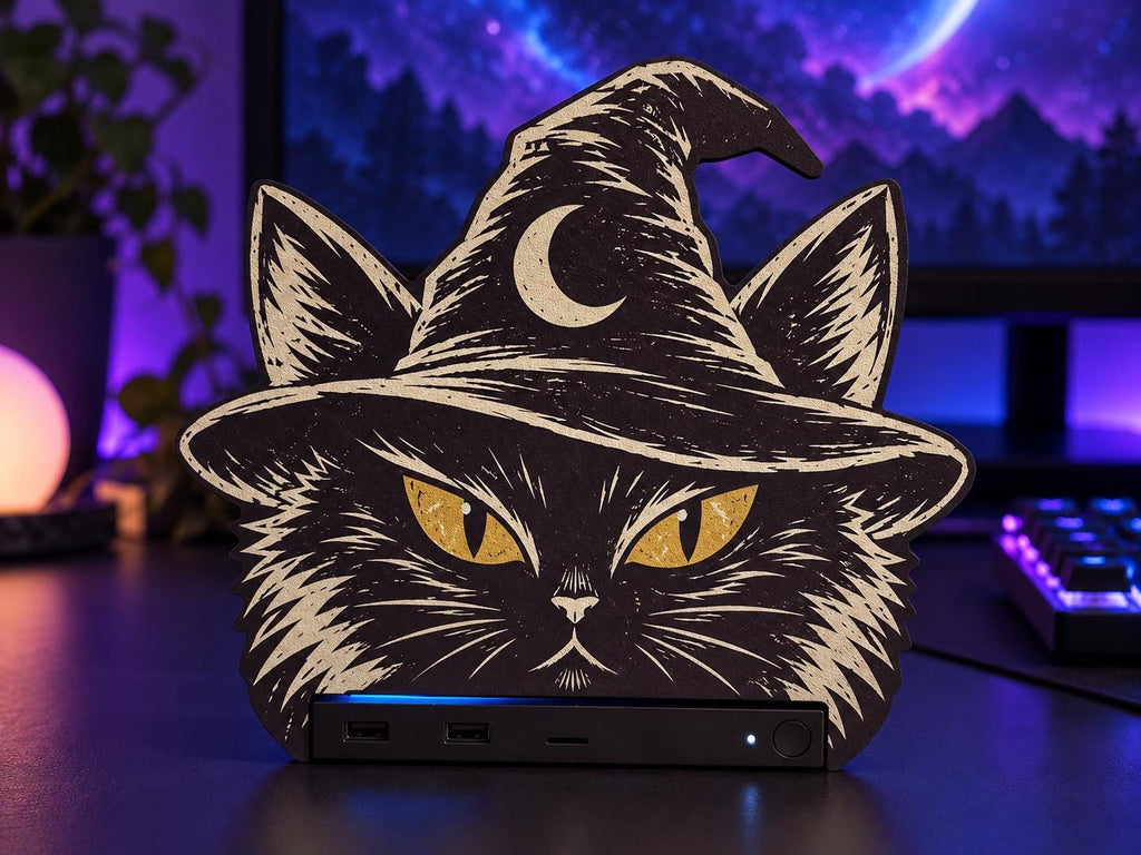 Steam Machine Faceplate Black Cat Witch Hat, Halloween Witchy Cat Magnetic Plate, UV Printed Console Cover, Spooky Gamer Gift, black cat witch hat faceplate installed on the Steam Machine on a desk in front of a computer monitor with purple ambient lighting and a backlit keyboard