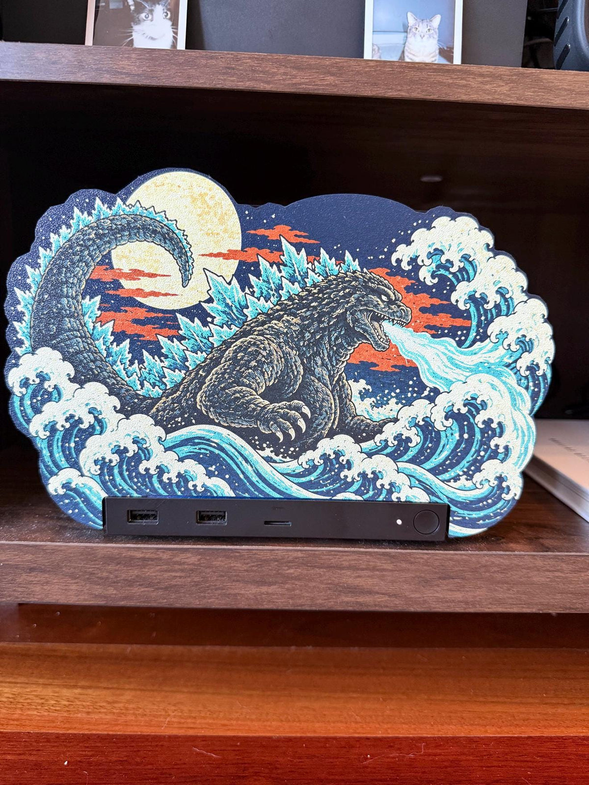 Steam Machine Faceplate, Custom Faceplate, Godzilla Kaiju Plate XL Oversized, Magnetic Console Cover, Monster Gamer Gift, Japan Wave Decor, Godzilla kaiju XL faceplate with a giant kaiju rising out of Japanese woodblock waves under a full moon, shown installed on the console on a wooden shelf, with the front USB ports and power button visible below the panel