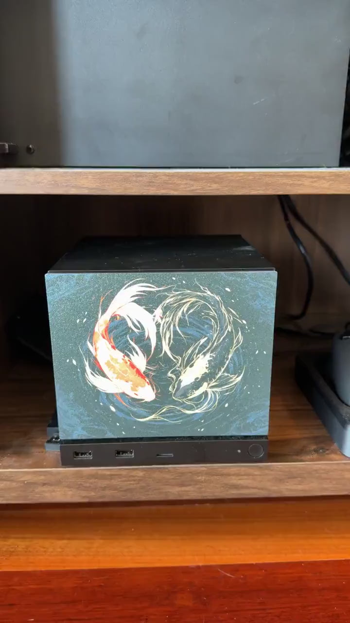 Koi Art Steam Machine Faceplate | Dark Teal Japanese Fish Panel | Magnetic UV Printed Cover | Zen Gamer Gift, video showing hands snapping the faceplate onto the console on a wooden shelf, demonstrating the magnetic fit