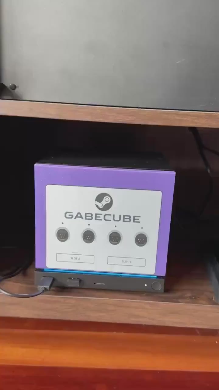 3D Printed GameCube Faceplate – Indigo Purple Steam Machine Controller Panel, video clip of hands attaching the GabeCube indigo purple faceplate onto the console in a wooden shelf