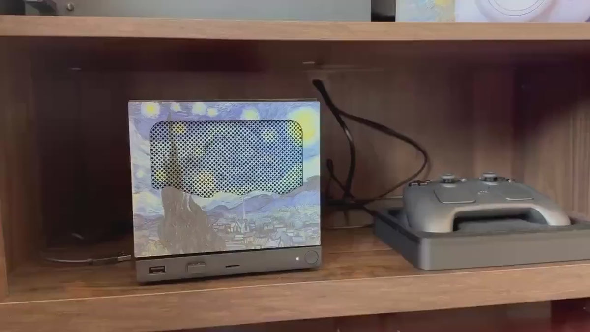 New Mesh!! Starry Night Steam Machine Faceplate Van Gogh Front Panel Fine Art UV Printed Magnetic Classic Painting Gamer Gift, video showing hands holding the mesh faceplate up to the console on a wooden shelf, demonstrating the magnetic snap-on fit